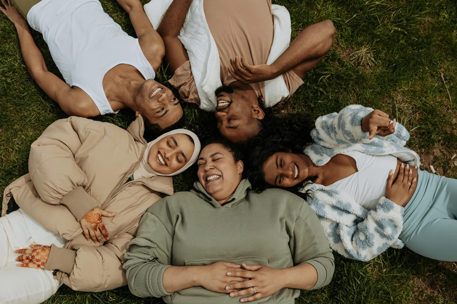 image of people laying on grass